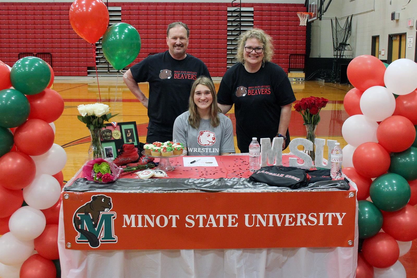 Langham Creek High School senior Annika Gotlieb, seated, signed a letter of intent to Minot State University.
